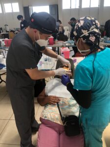Dr. Yoo working with a dental patient in Guatemala